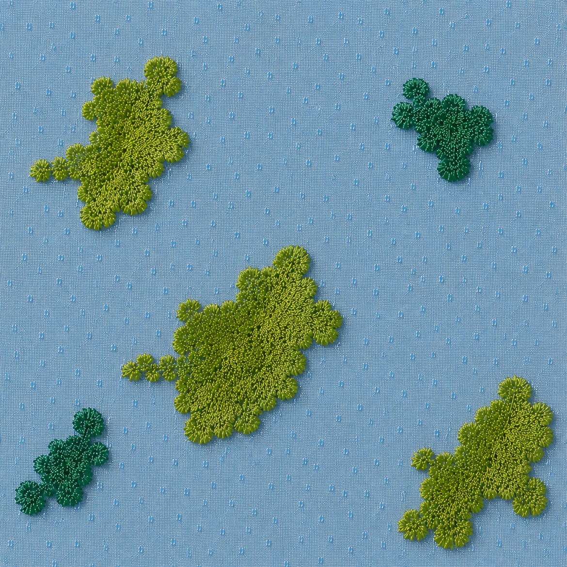 Blue textile with raised green embroidery patches.