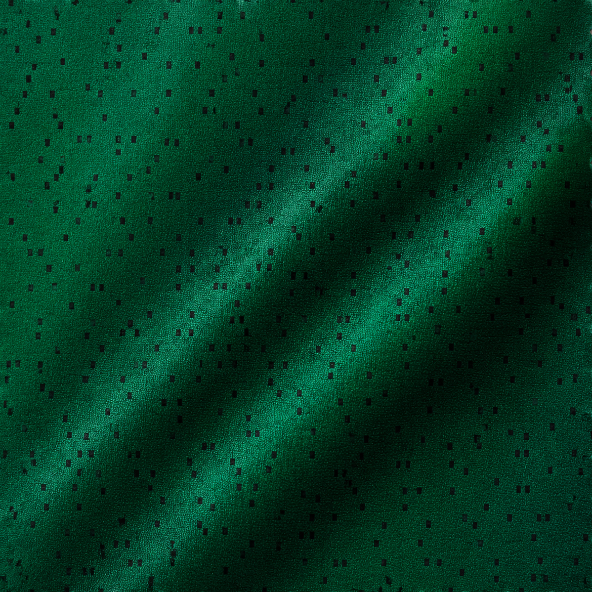 Green textile with dark encoded punch-card pattern.